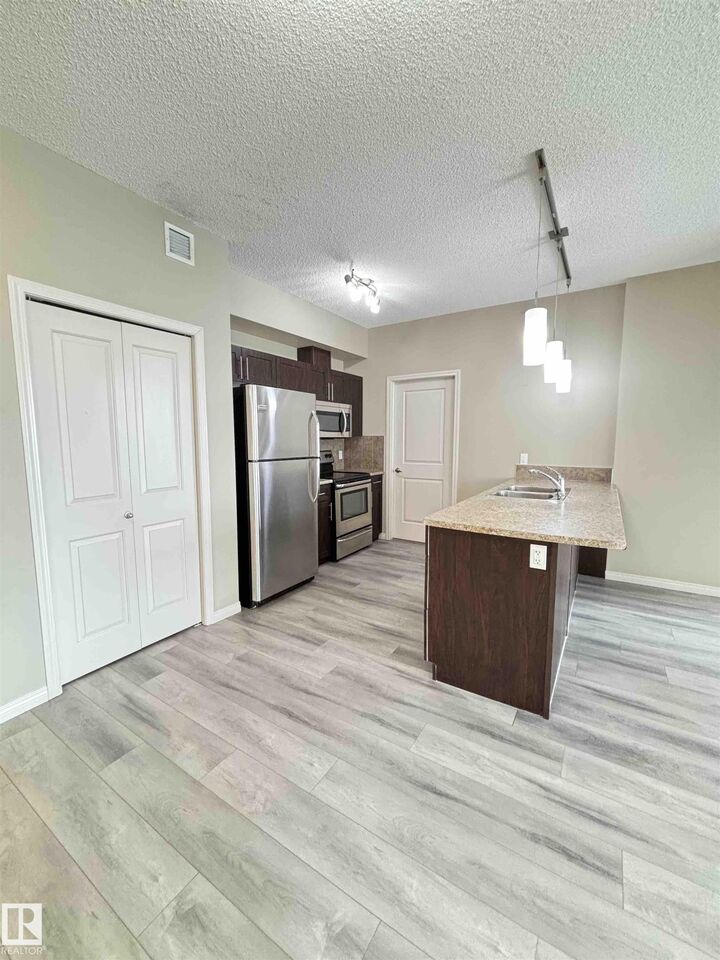 Property Photo: 111 Ambelside Drive SW 408 AB T6W 0J4