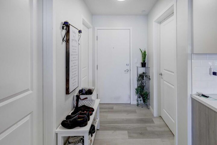 Property Photo: 360 Harvest Hills Way 106 AB T3K 2S1