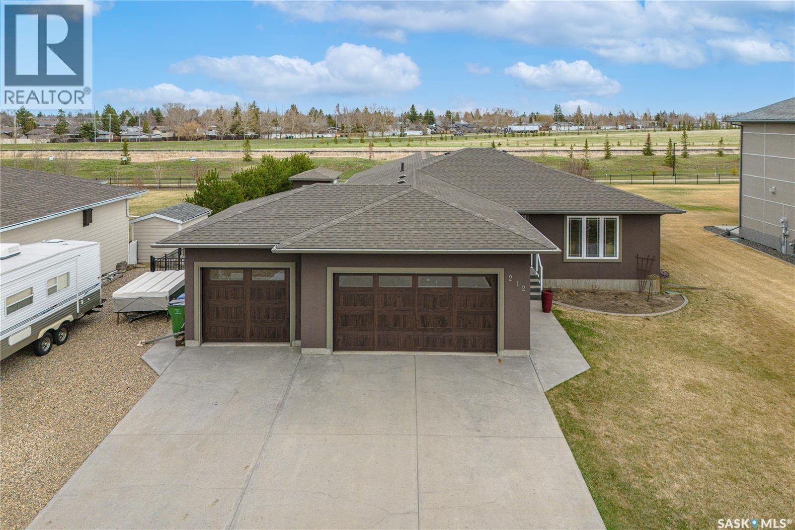 Property Photo:  212 Iron Bridge Drive  SK S6J 0B5 