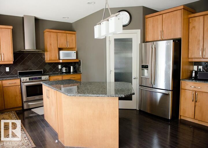 Property Photo:  6162 Maynard Crescent NW  AB T6R 0H8 