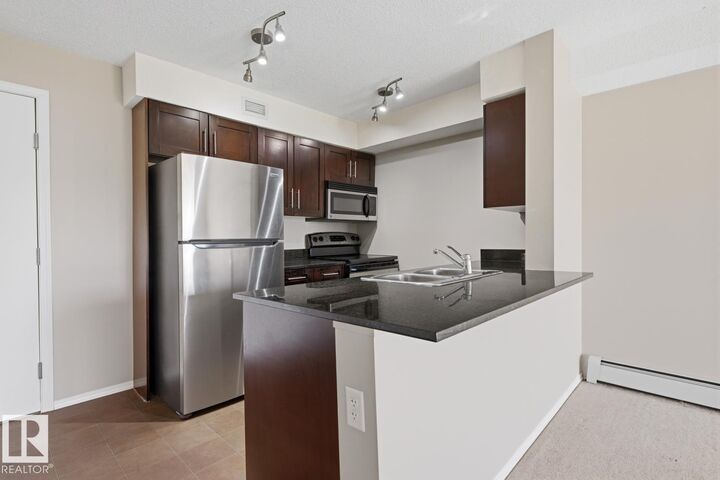 Property Photo:  11804 22 Avenue SW 303  AB T6W 2A2 