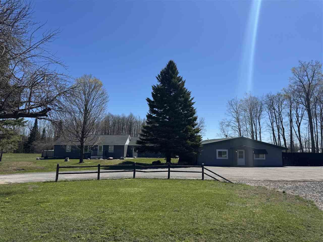 Property Photo:  6690 N U.s. 31  MI 49755 