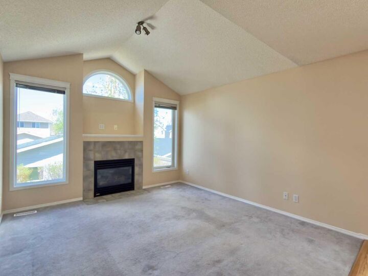 Property Photo: 206 Tuscany Drive NW AB T3L 2C4