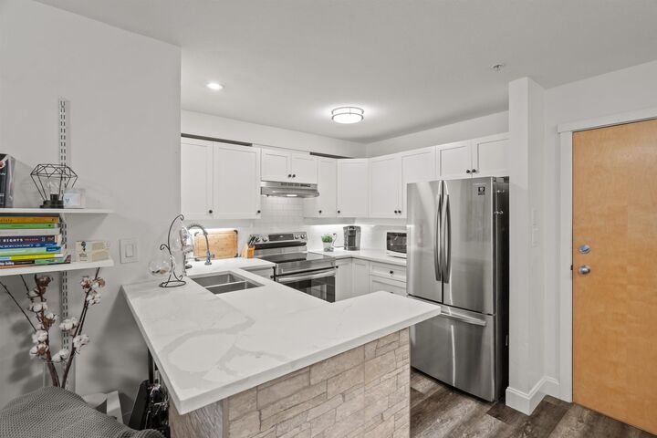 Property Photo: 15 Smokey Smith Place 213 BC V3L 5V7
