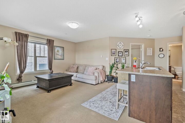 Property Photo: 103 Ambleside Drive SW 206 AB T6W 0J4