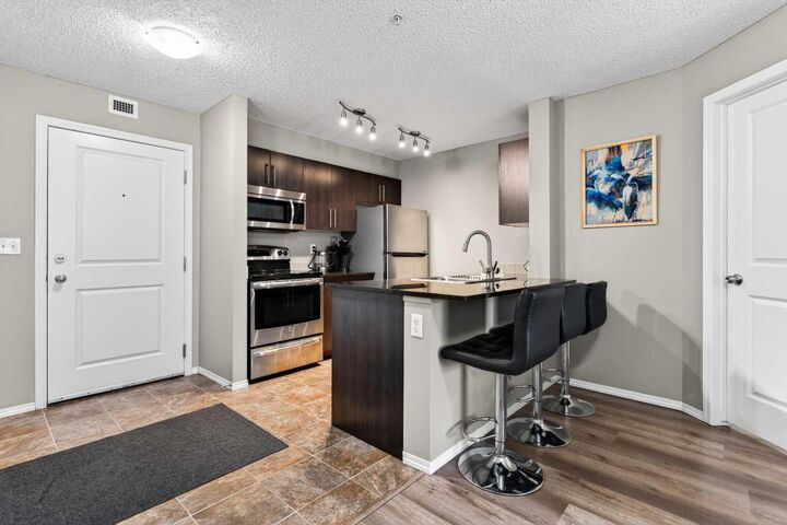 Property Photo:  403 Mackenzie Way SW 9103  AB T4B 3V7 