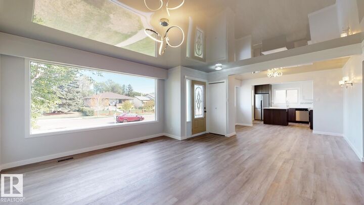 Property Photo:  11744 135 Street NW  AB T5M 1L3 
