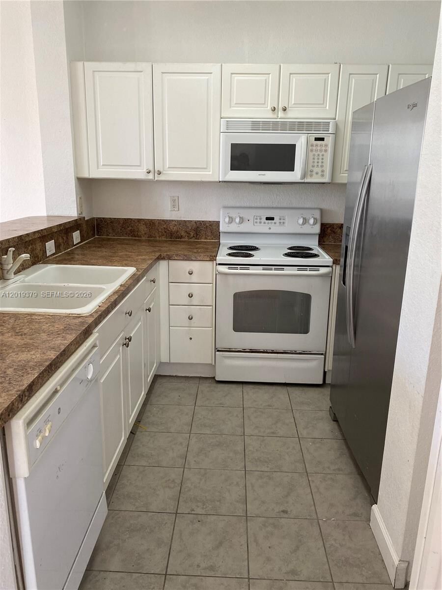 Property Photo:  3355 NE 13 Cir Dr. 201-28  FL 33033 