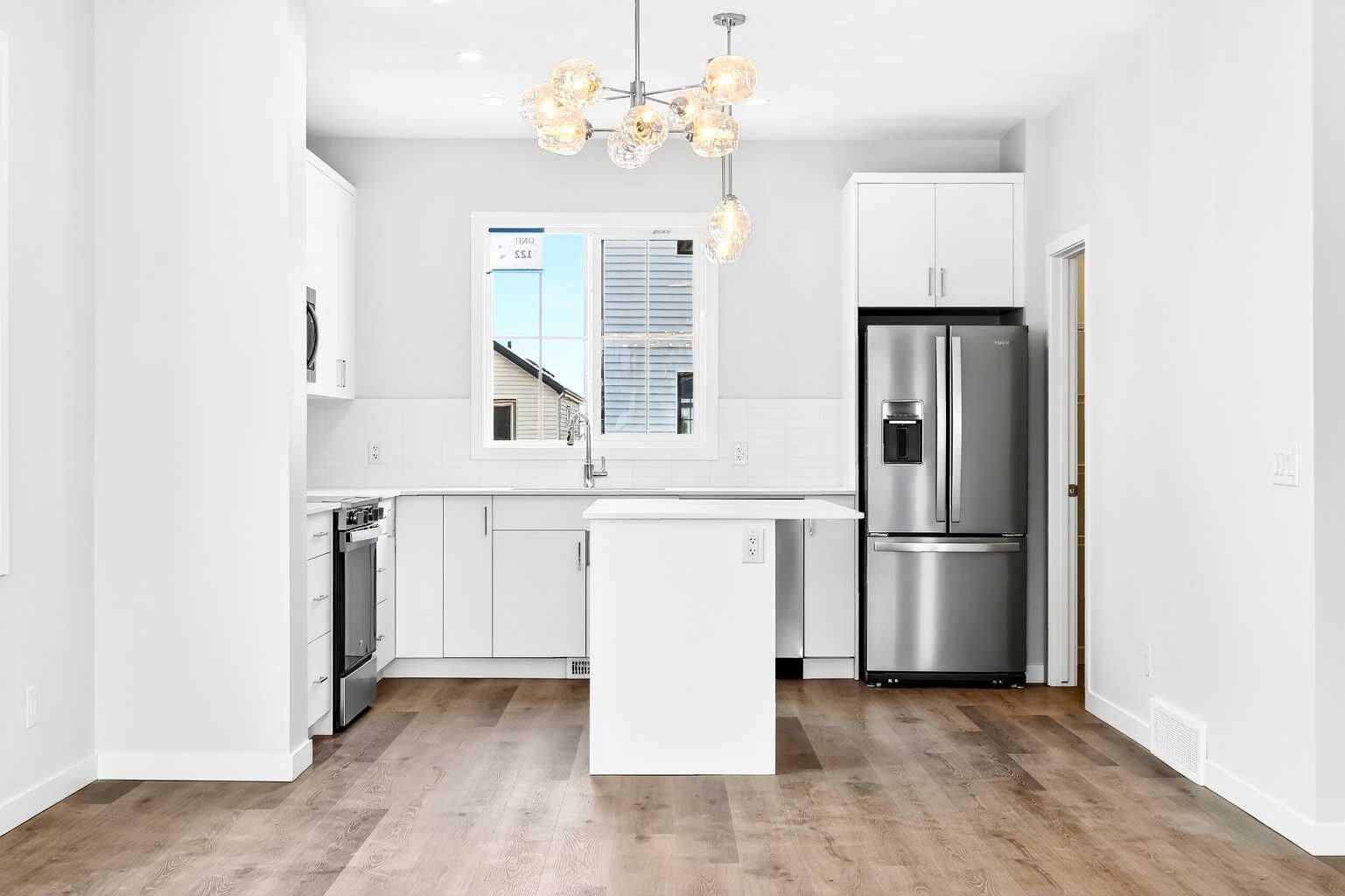 Property Photo: 40 Creekside Way SW 107 AB T2X 6E2