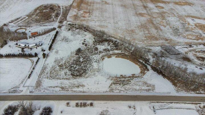 Property Photo:  253032 Township Road 244  AB T1P 1H5 