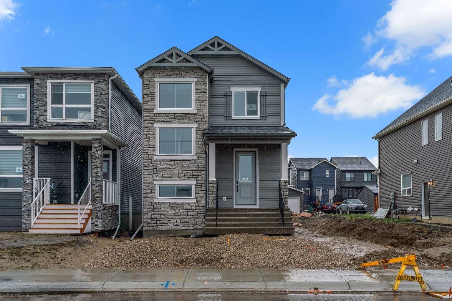Property Photo: 50 Creekview Gardens SW AB T2X 4Y1