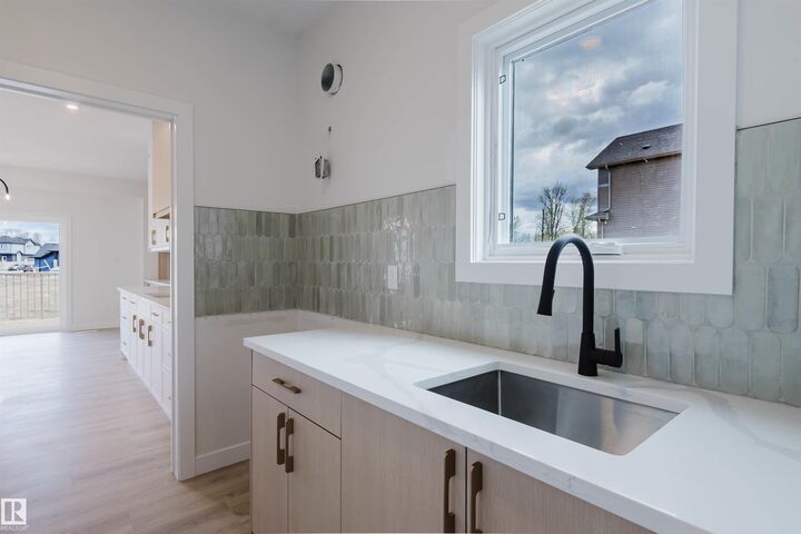 Property Photo: 703 Elderberry Close NW AB T6M 3J6