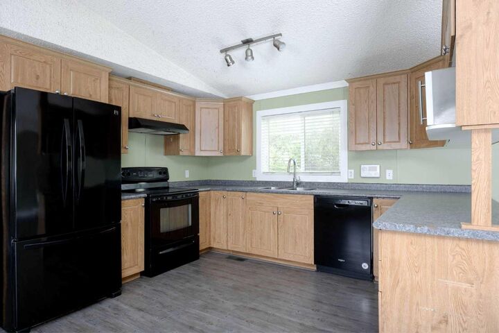 Property Photo: 132 Greentree Crescent AB T9H 3Y2
