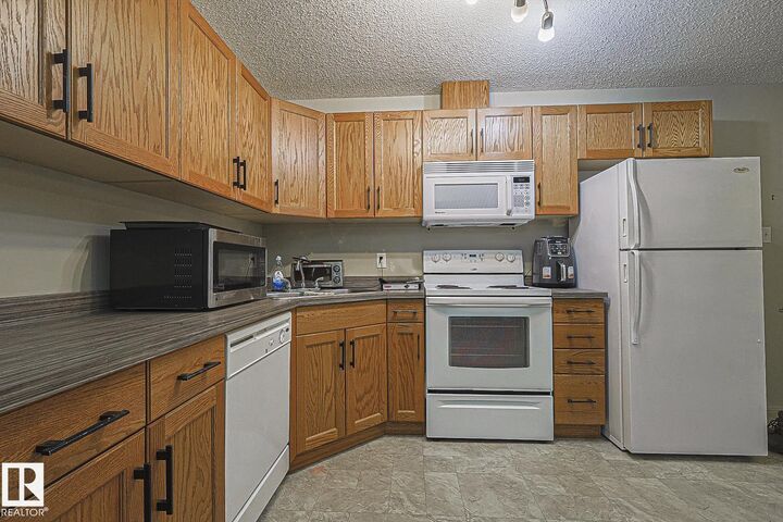 Property Photo: 309 Clareview Station Drive NW 119 AB T5Y 0C5