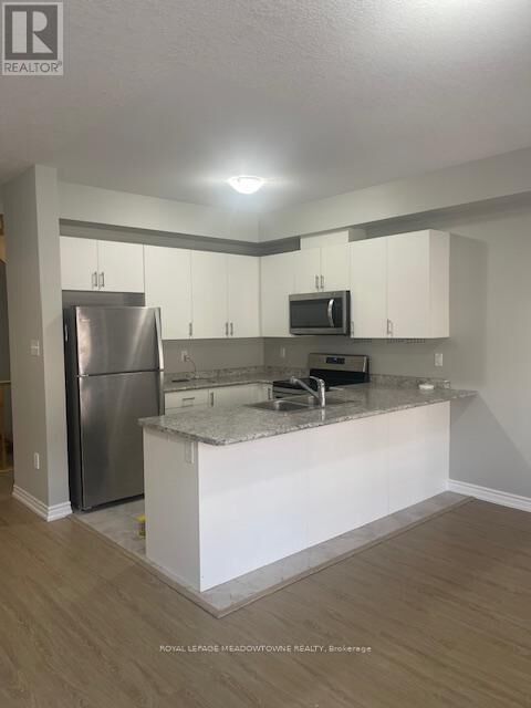 Property Photo: 88 Decorso Drive 29 ON N1L 0A1