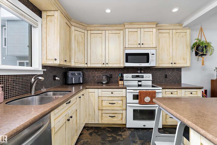 Property Photo: 4403 Riverbend Road NW 9 AB T6H 5S9