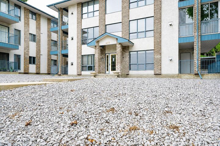 Property Photo:  407 Macleod Trail SE 4  AB T1A 8P7 