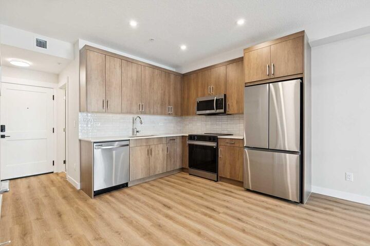Property Photo: 1802 Mahogany Boulevard SE 6103 AB T3M 4A5