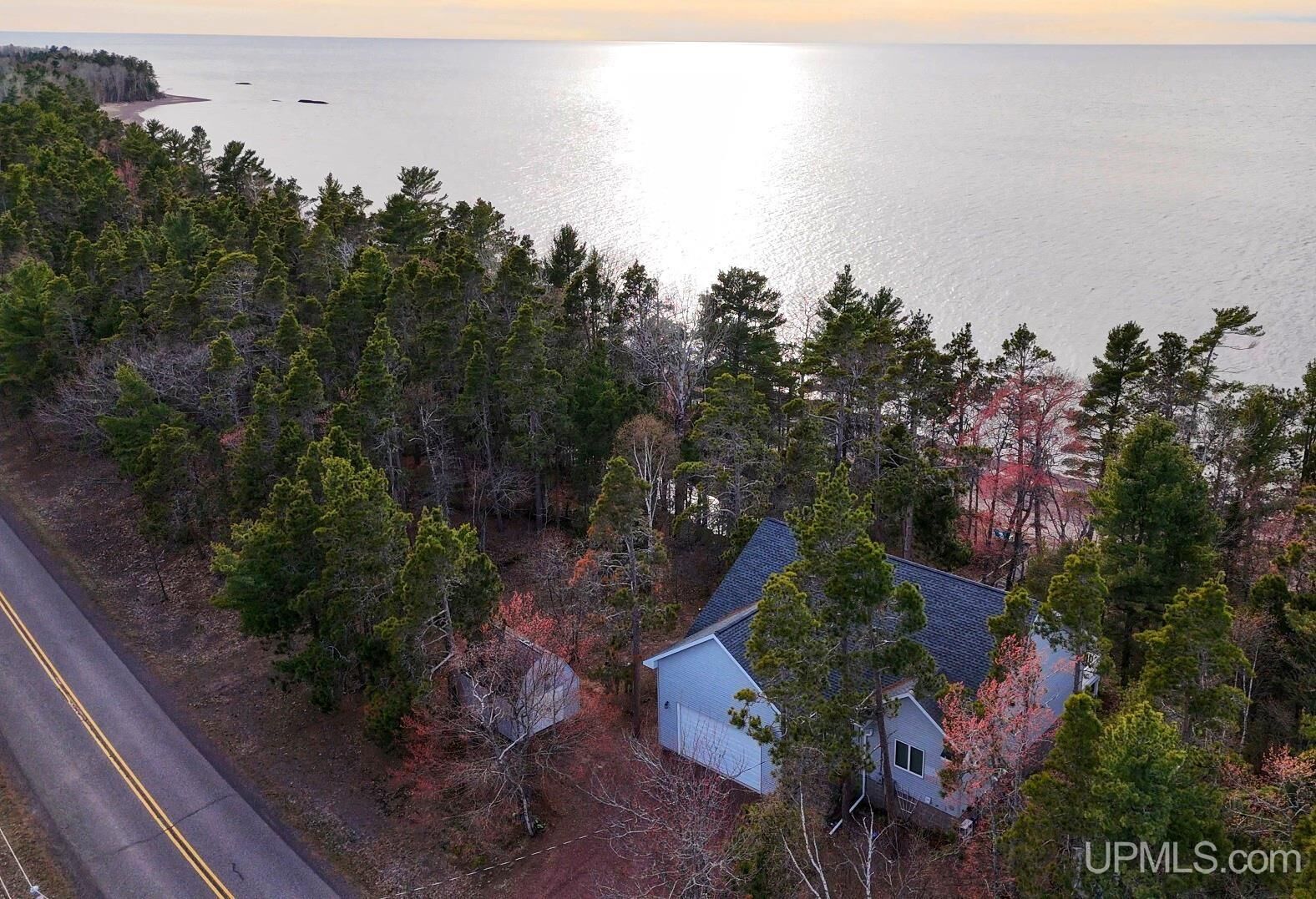 Property Photo:  5877 Five Mile Point Road  MI 49805 