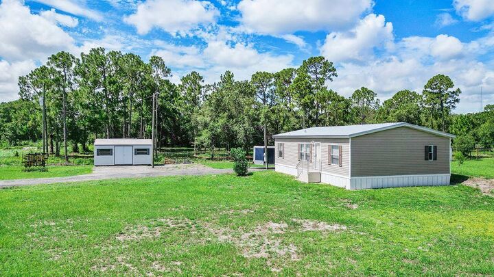 Property Photo: 220 N Sendero Street FL 33440