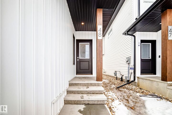Property Photo: 5122 213A Street NW 48 AB T6M 1M6