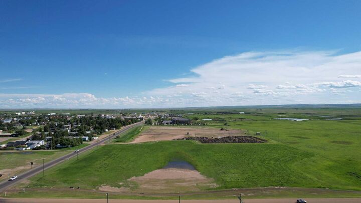 Property Photo: 605 Palliser Trail AB T0J 1P0