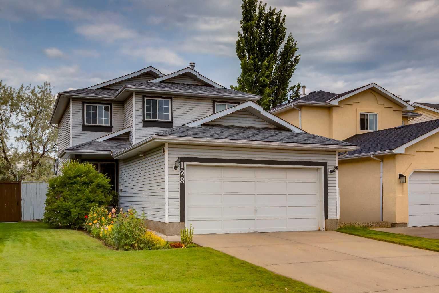 Property Photo:  128 Riverwood Close SE  AB T2C 3Z6 
