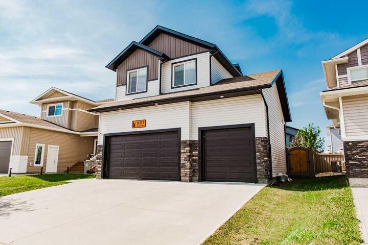 Property Photo: 11317 Tamarack Drive AB T8W 0L1