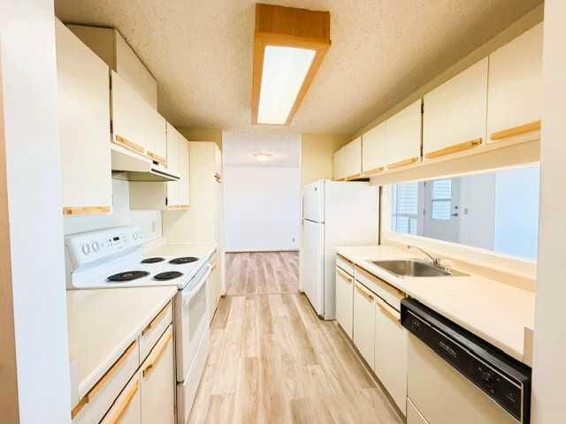 Property Photo: 201 12 Avenue SW 306E AB T0G 2A4