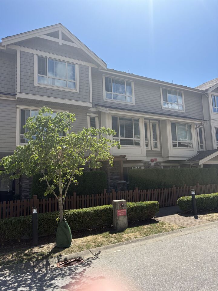 Property Photo: 19752 55A Avenue 27 BC V3A 3X2