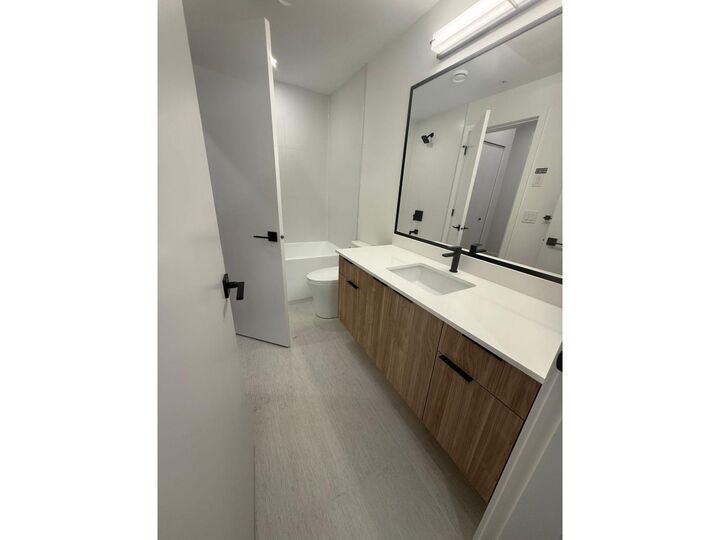 Property Photo: 14398 60 Ave Street 213 BC V3X 2N5