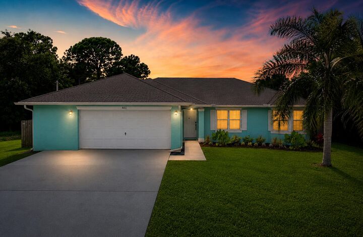 Property Photo:  402 SE Strait Avenue  FL 34983 