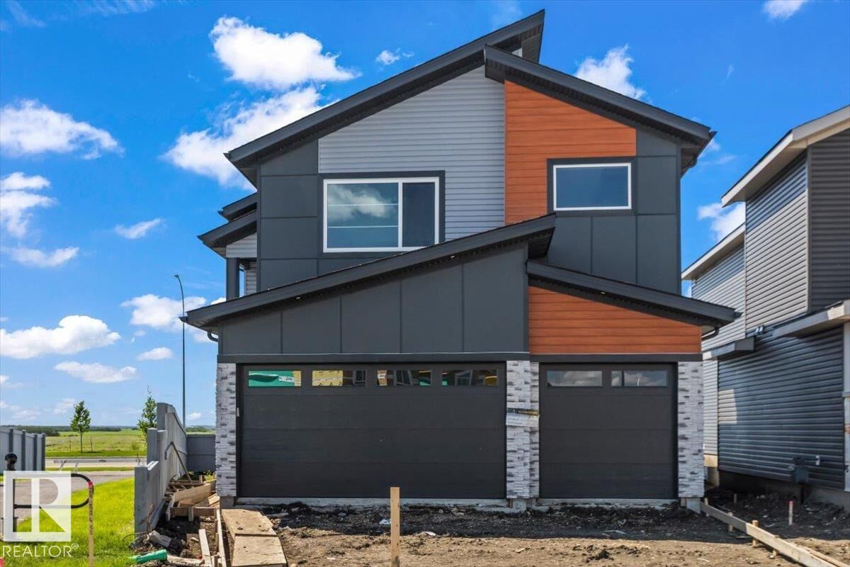 Property Photo: 22 Owl Ridge Close AB T8L 0P6