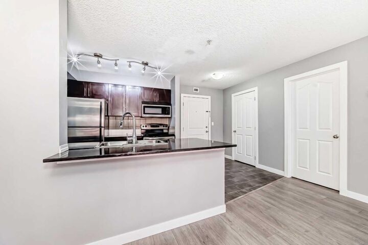 Property Photo: 403 Mackenzie Way SW 4304 AB T4B 3V7
