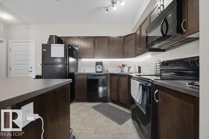 Property Photo: 13835 155 Avenue NW 321 AB T6V 0B7