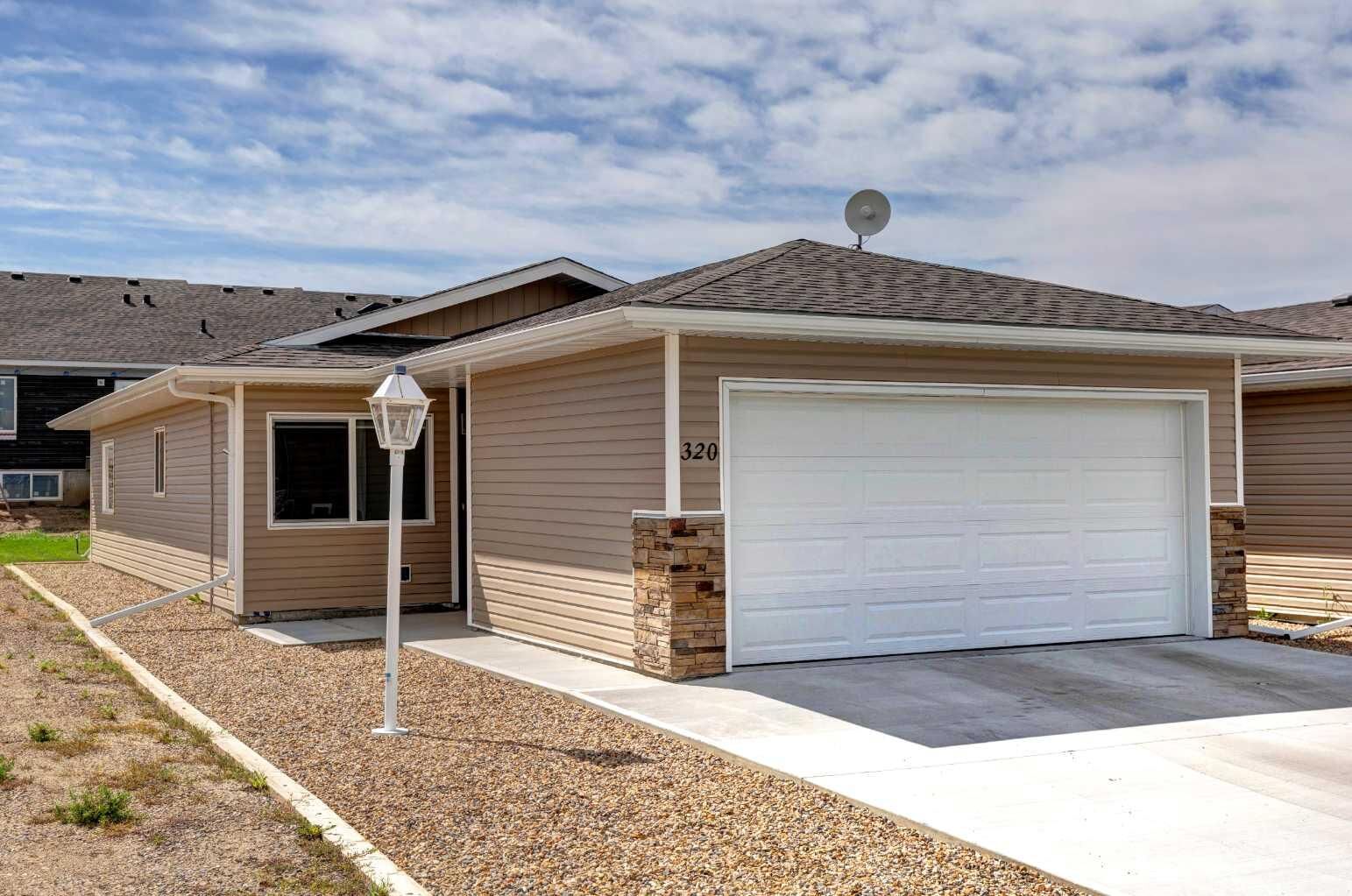 Property Photo: 320 Whispering Way AB T0L 2B0
