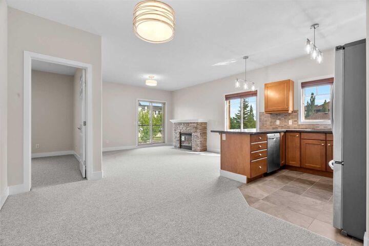 Property Photo:  92 Crystal Shores Road 4203  AB T1S 2N2 