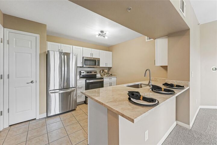 Property Photo:  12824 Ironstone Way 302  CO 80134 
