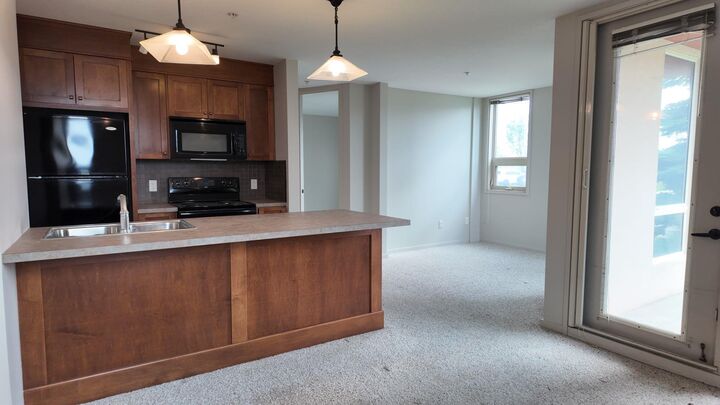 Property Photo:  105 Railway Avenue SW 1103  AB T4B 0E3 