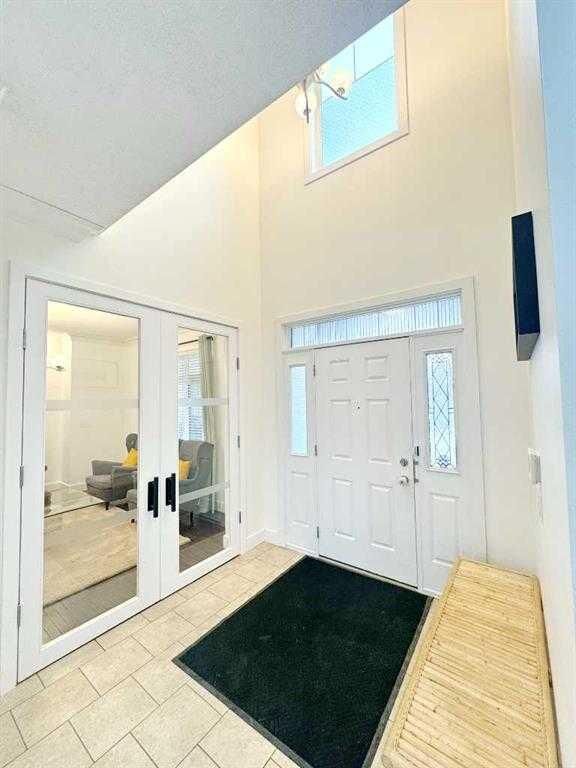 Property Photo: 109 Kinniburgh Boulevard E Boulevard E AB T1X 0L9
