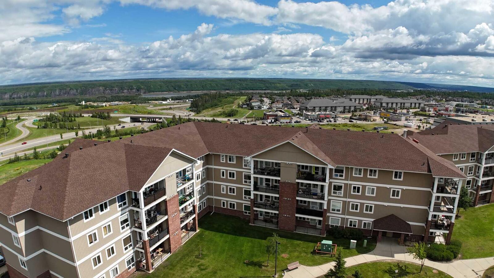 Property Photo: 248A Grosbeak Way 307 AB T9K 0V9