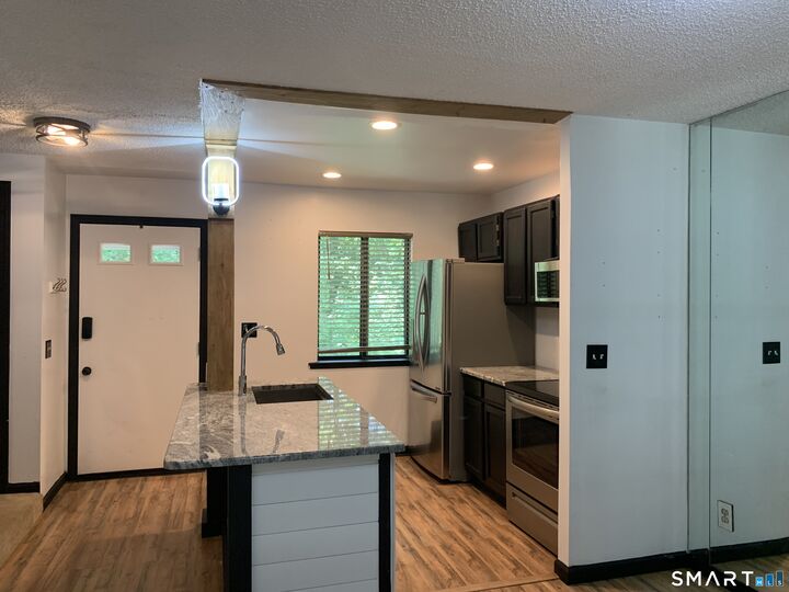 Property Photo:  11 King Arthur Drive 5A  CT 06357 
