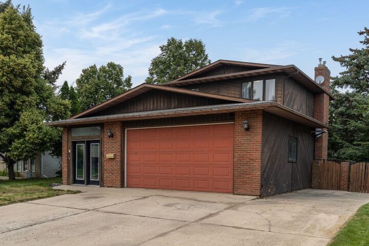 Property Photo: 4 Greenwood Court SW AB T1A 7X7