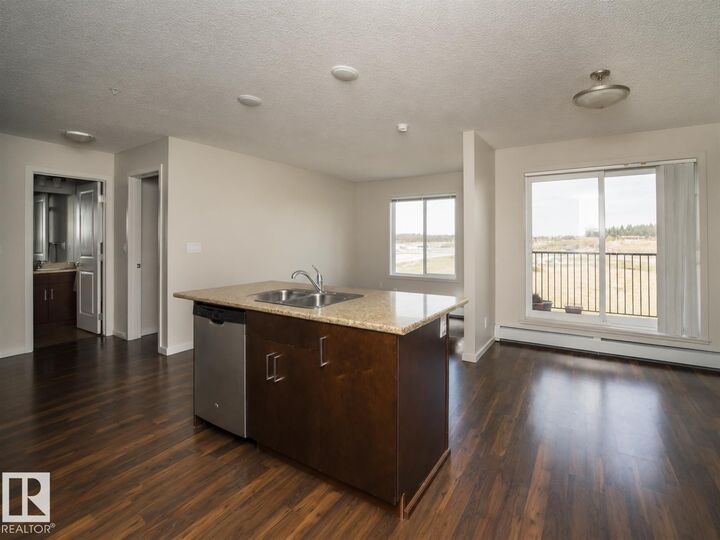 Property Photo:  5515 7 Avenue SW 325  AB T6X 2A8 