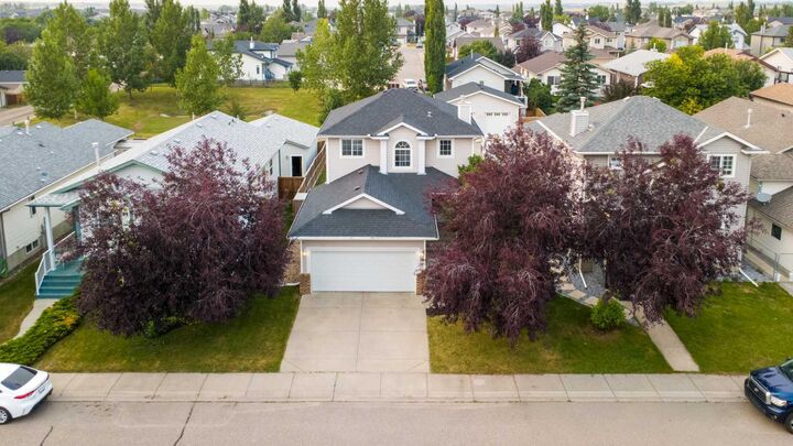 Property Photo: 56 Silver Creek Boulevard AB T4B 2P6