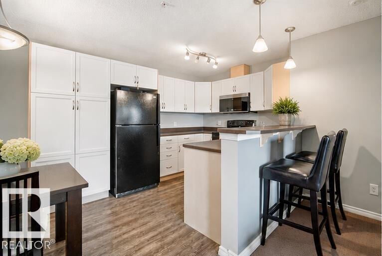 Property Photo:  2436 Guardian Road NW 340  AB T5T 2P5 