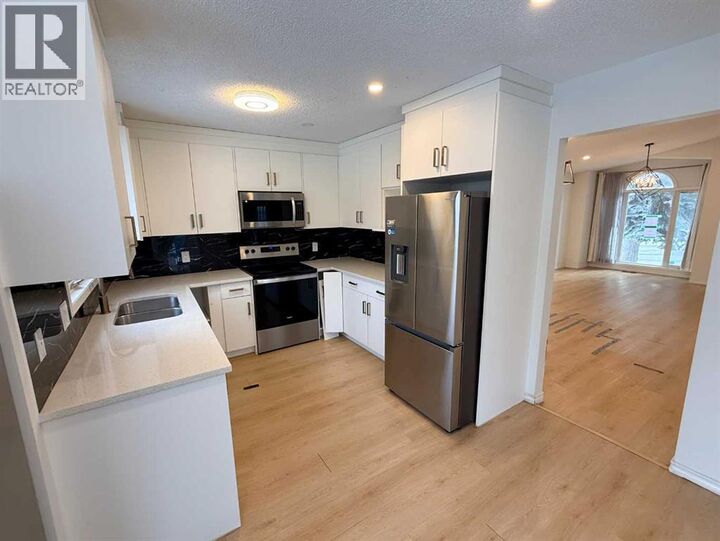 Property Photo: 651 Macewan Drive Northwest AB T3K 3R1