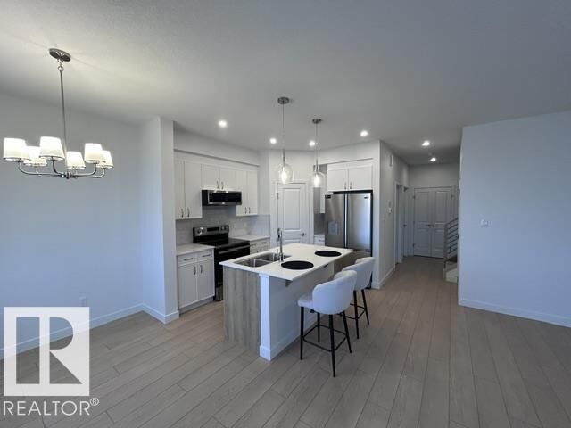 Property Photo:  20936 16 Avenue NW  AB T6M 3J4 