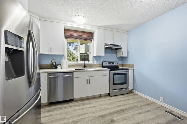 Property Photo:  8423 Mill Woods Road NW  AB T6K 2P6 
