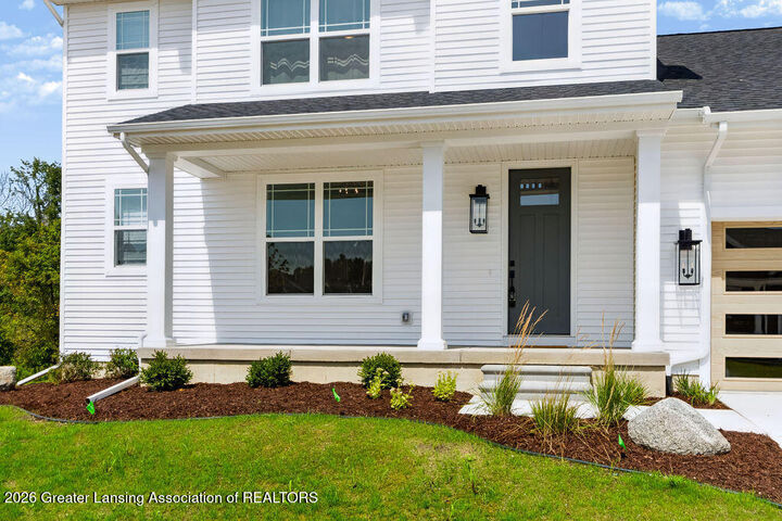 Property Photo:  602 Magenta Court  MI 48840 